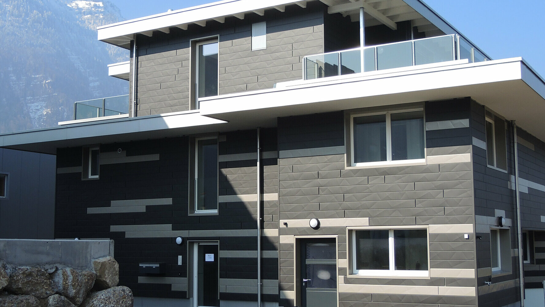 Creative façade design with the new PREFA Siding.X façade panels  in two different colours