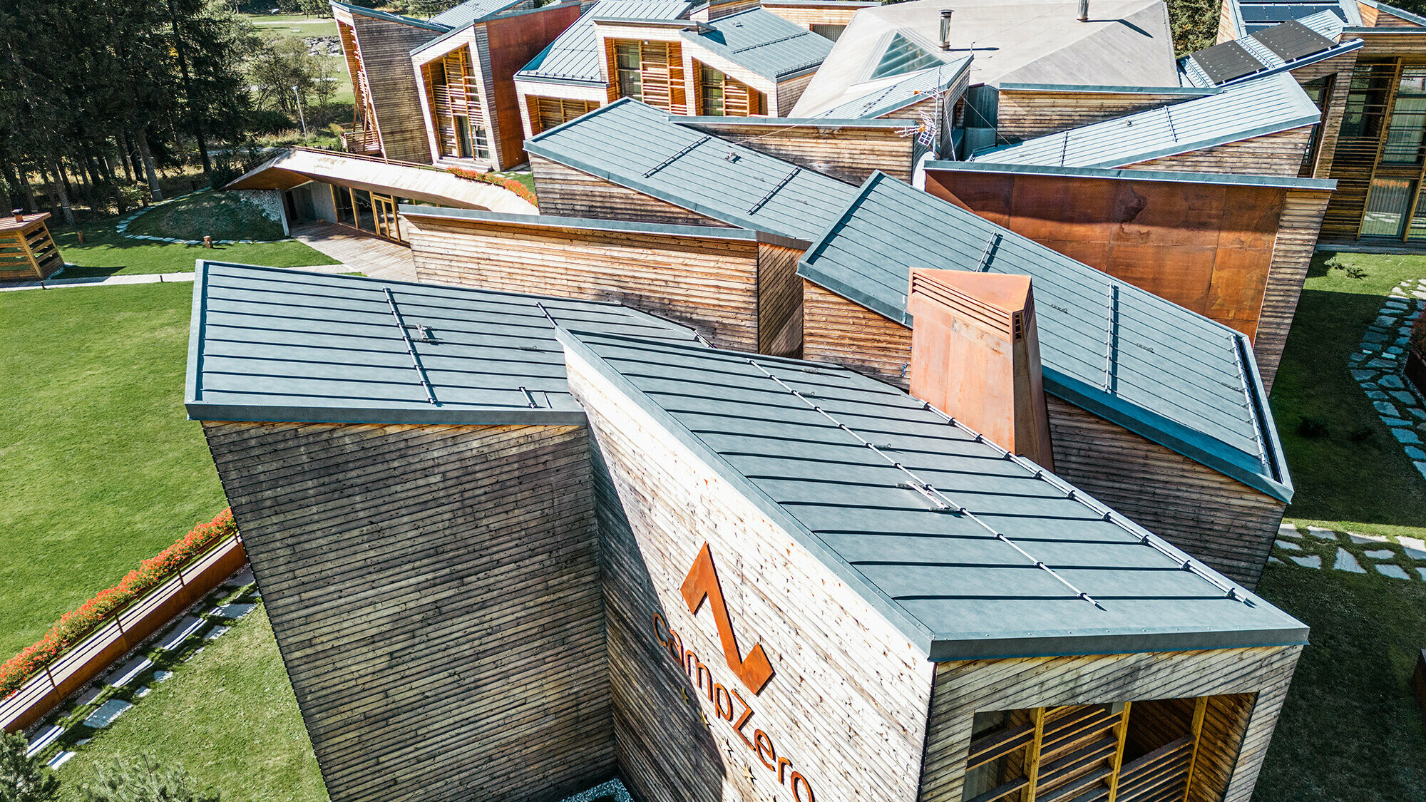 Detail view of one of the sides of the resort, the stone-grey roofscape is in view. 