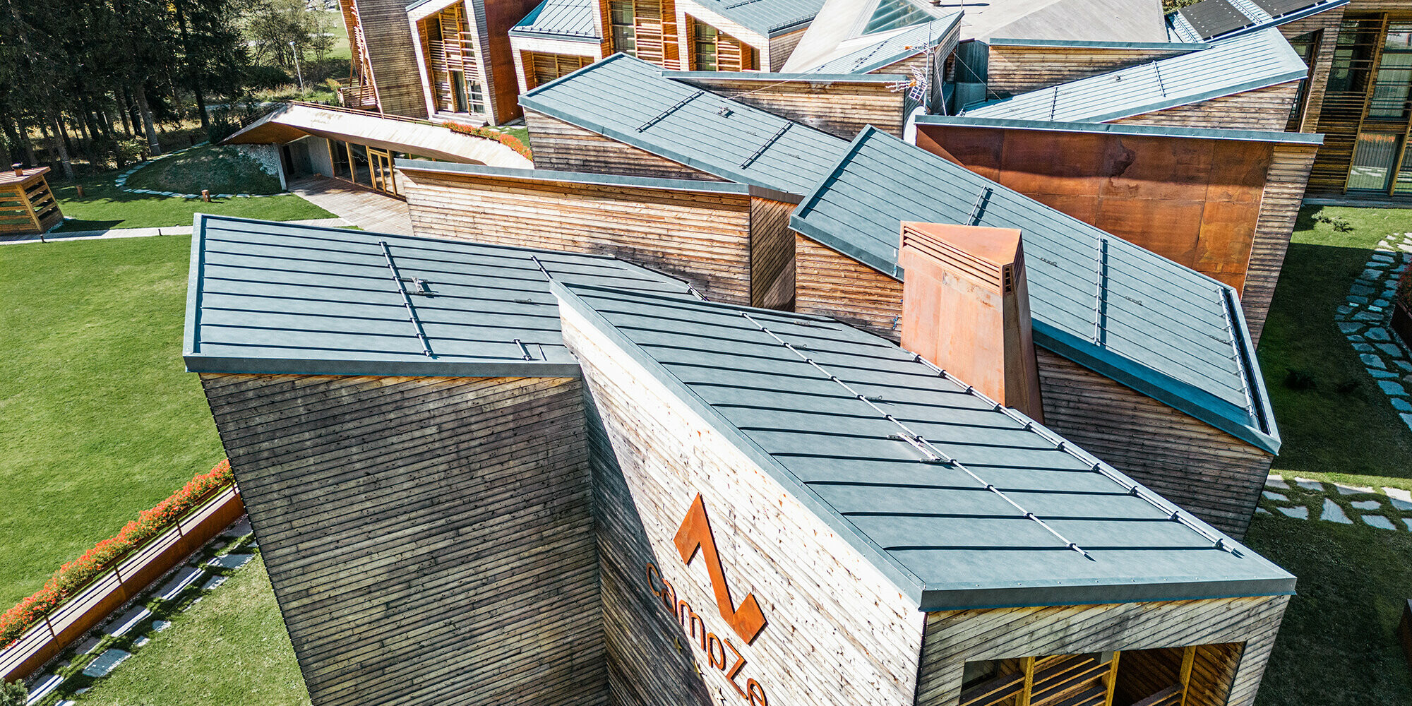 Detail view of one of the sides of the resort, the stone-grey roofscape is in view. 