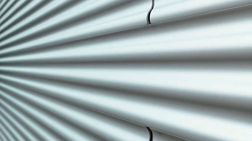 Detailed view of the PREFA ripple profile in a plain anodised, corrugated façade profile