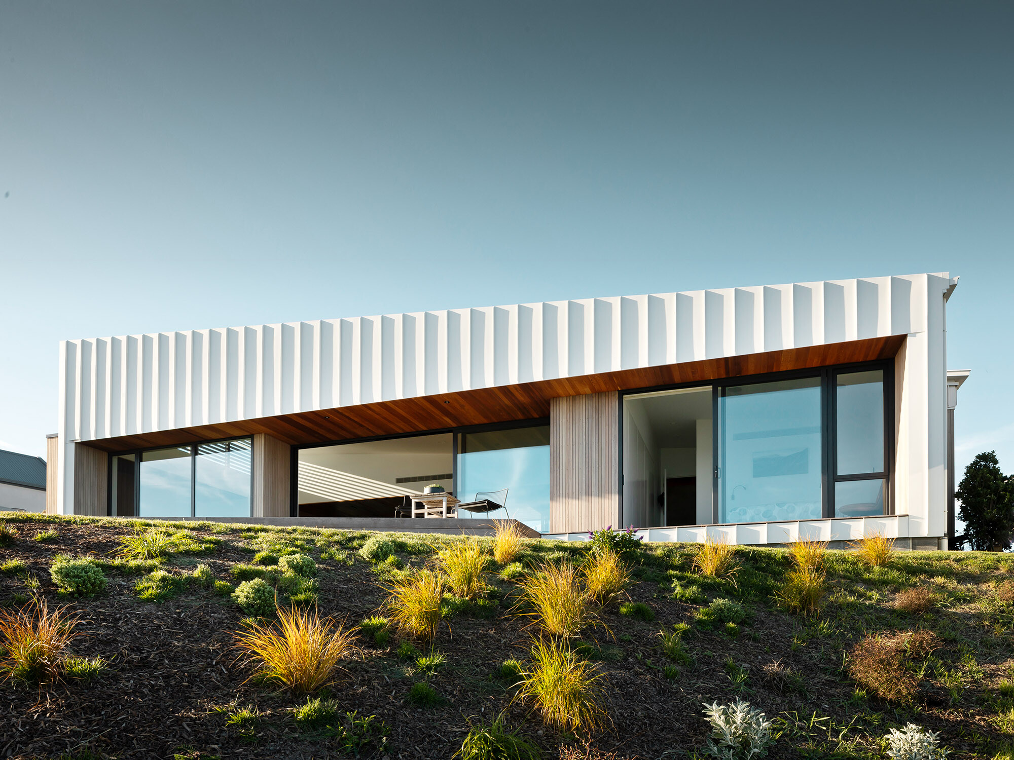 The Whitecaps House and its strikingly structured façade from a worm's eye view.