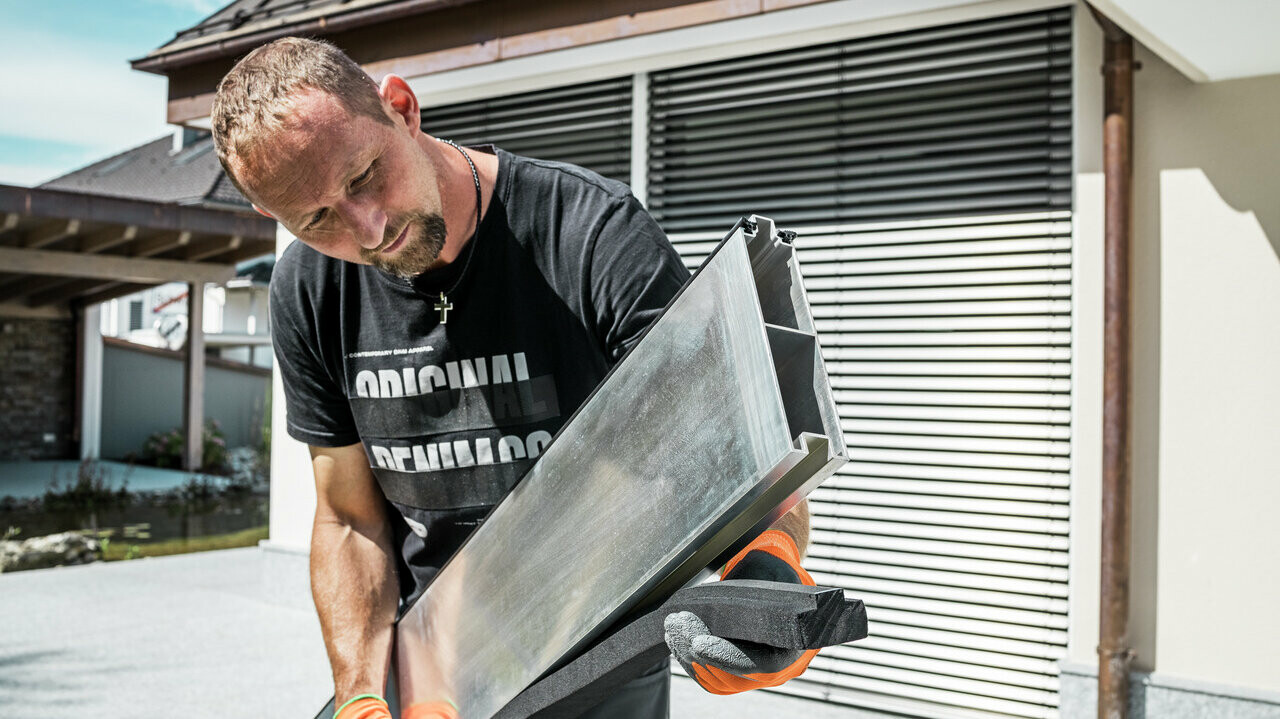 Close-up of the PREFA flood protection barrier panel with rubber seal, which is the first to be inserted into the profile rail.