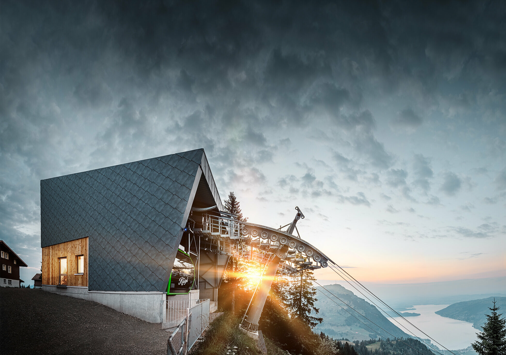 The Rigi Railway Scheidegg mountain station at dawn. The newly refurbished mountain station was clad in the PREFA 44 x 44 rhomboid façade tile in P.10 stone grey.