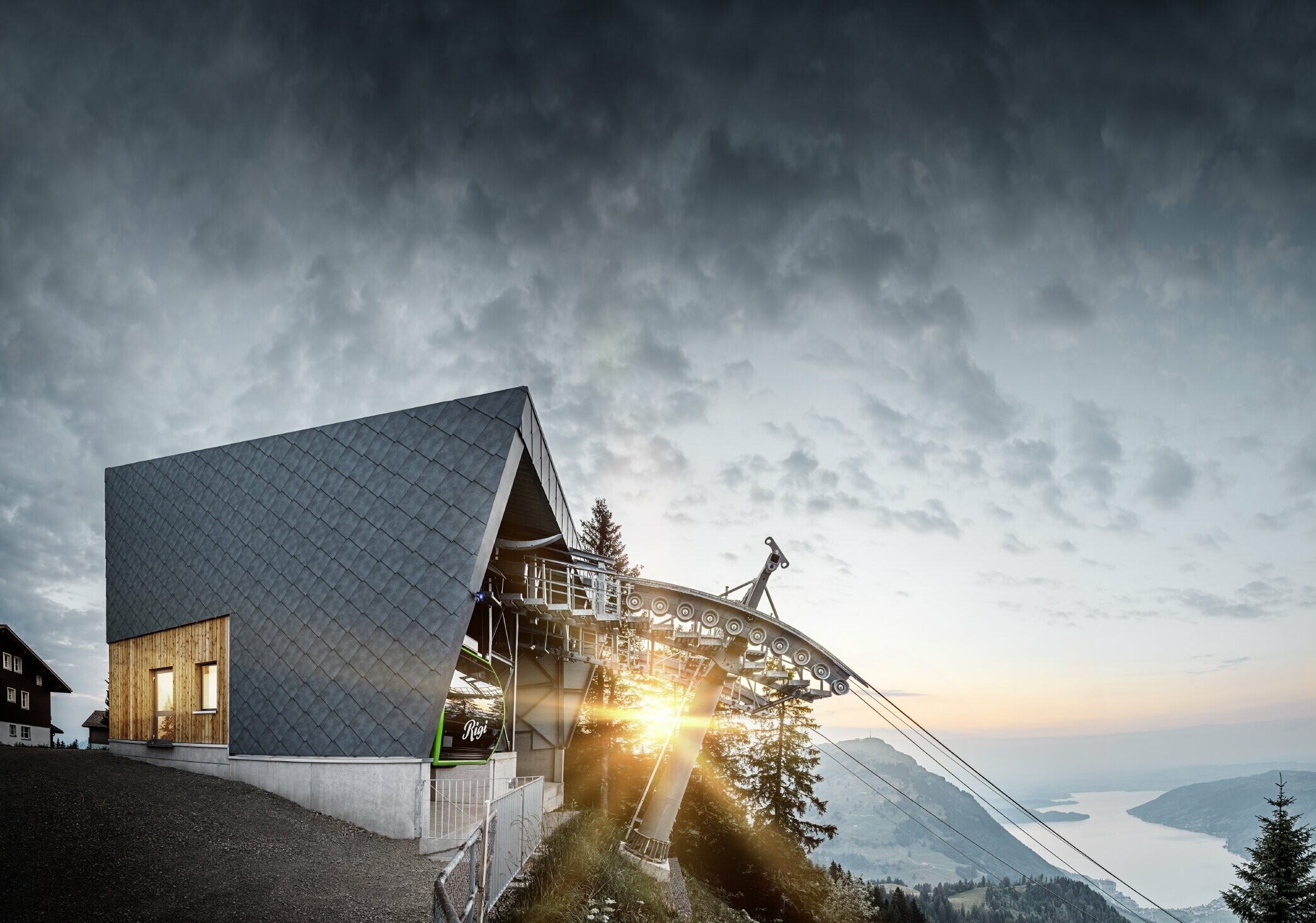 The Rigi Railway Scheidegg mountain station at dawn. The newly refurbished mountain station was clad in the PREFA 44 x 44 rhomboid façade tile in P.10 stone grey.