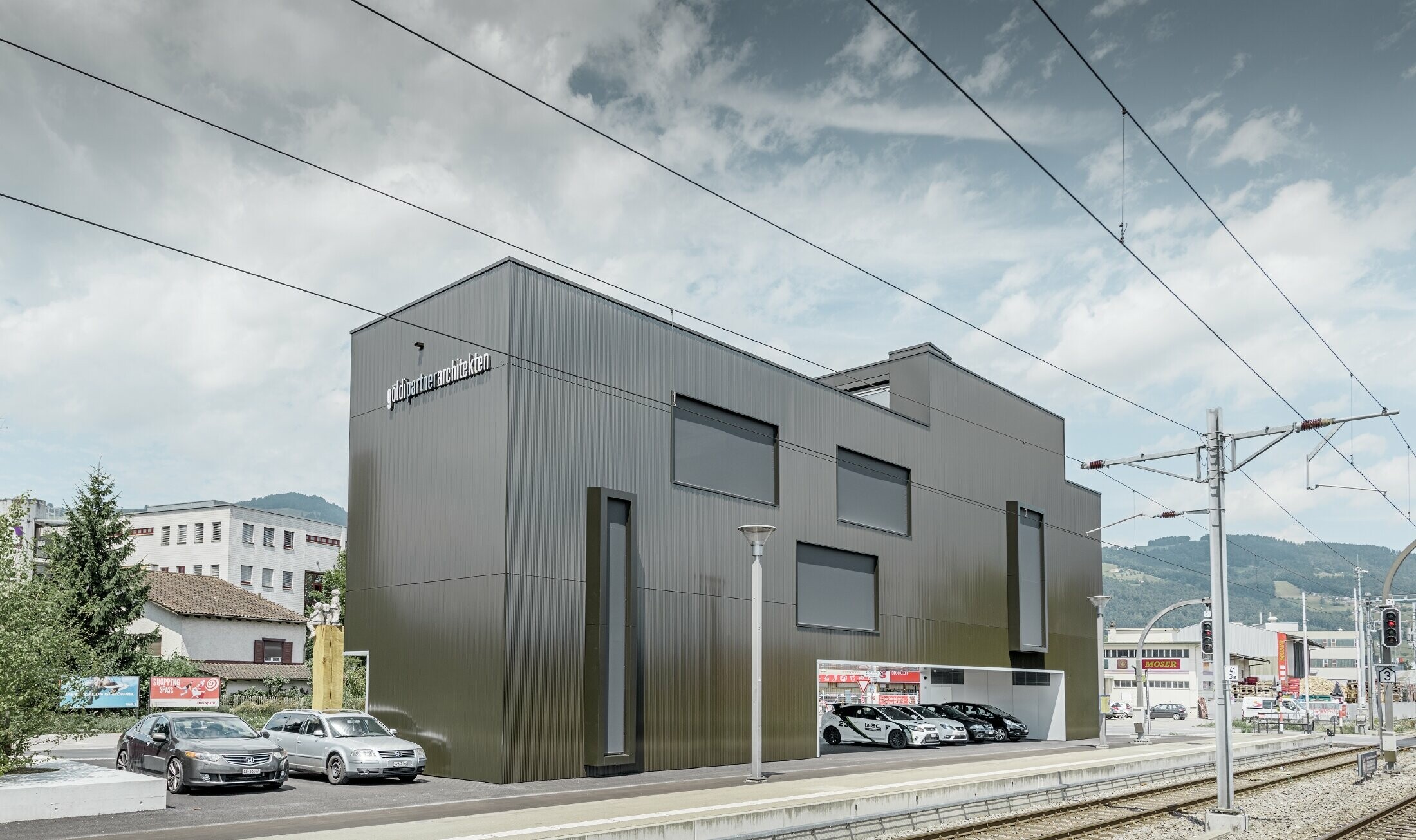 Modern loft office with flat roof and the robust zig zag profile in umbra dark grey