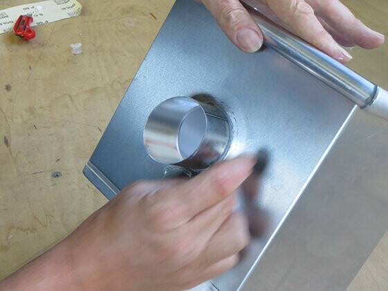 Clean the PREFA leader head after pushing the outlet through the hole – remove any excess PREFA special ad-hesive.