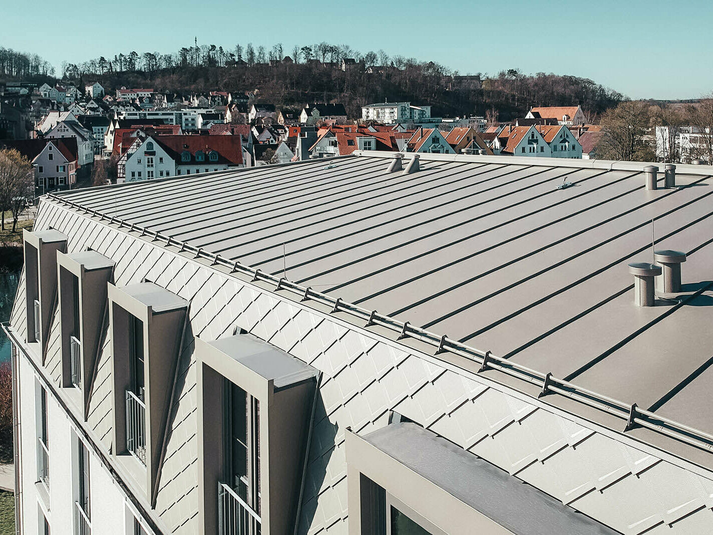 View of the roof surface with PREFA rhomboid roof and façade tiles and Prefalz roofing membranes