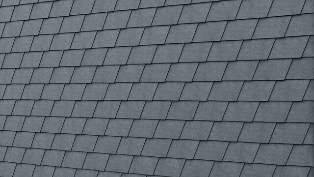 Detailed image of the PREFA façade shingle in P.10 stone grey