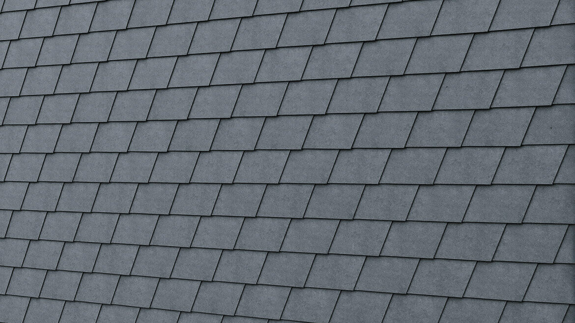Detailed image of the PREFA façade shingle in P.10 stone grey