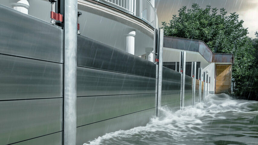 Close-up of the PREFA flood protection made of aluminium, which always withstands flood disasters and protects the detached house in the background.