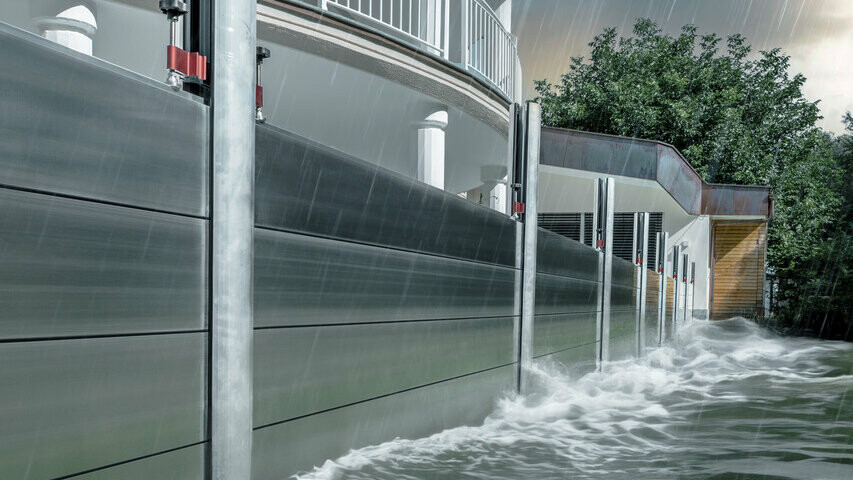 Close-up of the PREFA flood protection made of aluminium, which always withstands flood disasters and protects the detached house in the background.