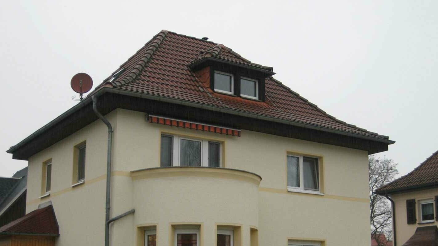Hipped roof before renovation with PREFA shingles and dormer
