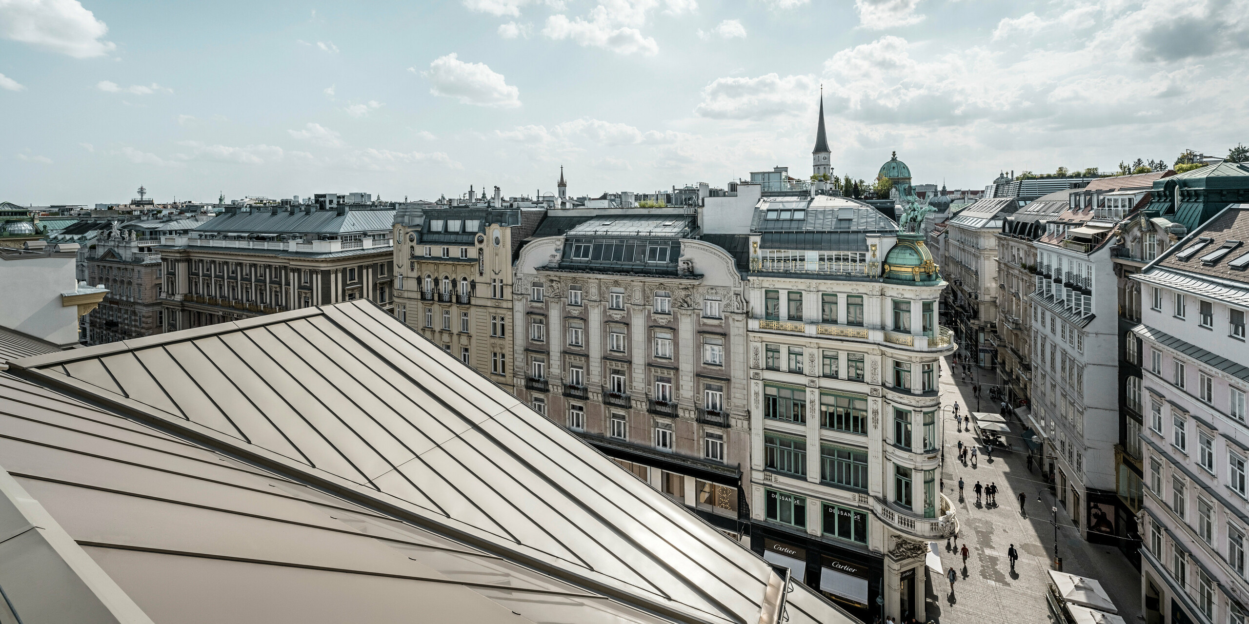 A sweeping view of the roofs of Vienna, in the left of the picture the Prefalz sheets on the Rosewood Hotel Vienna in the noble shaded of bronze.