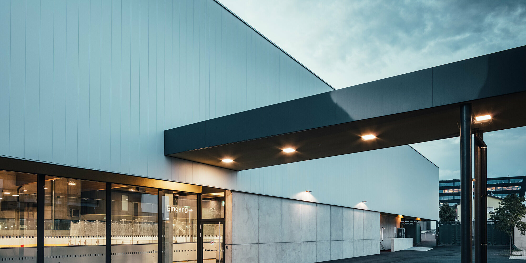 Roofing on the side of the ice rink in black.