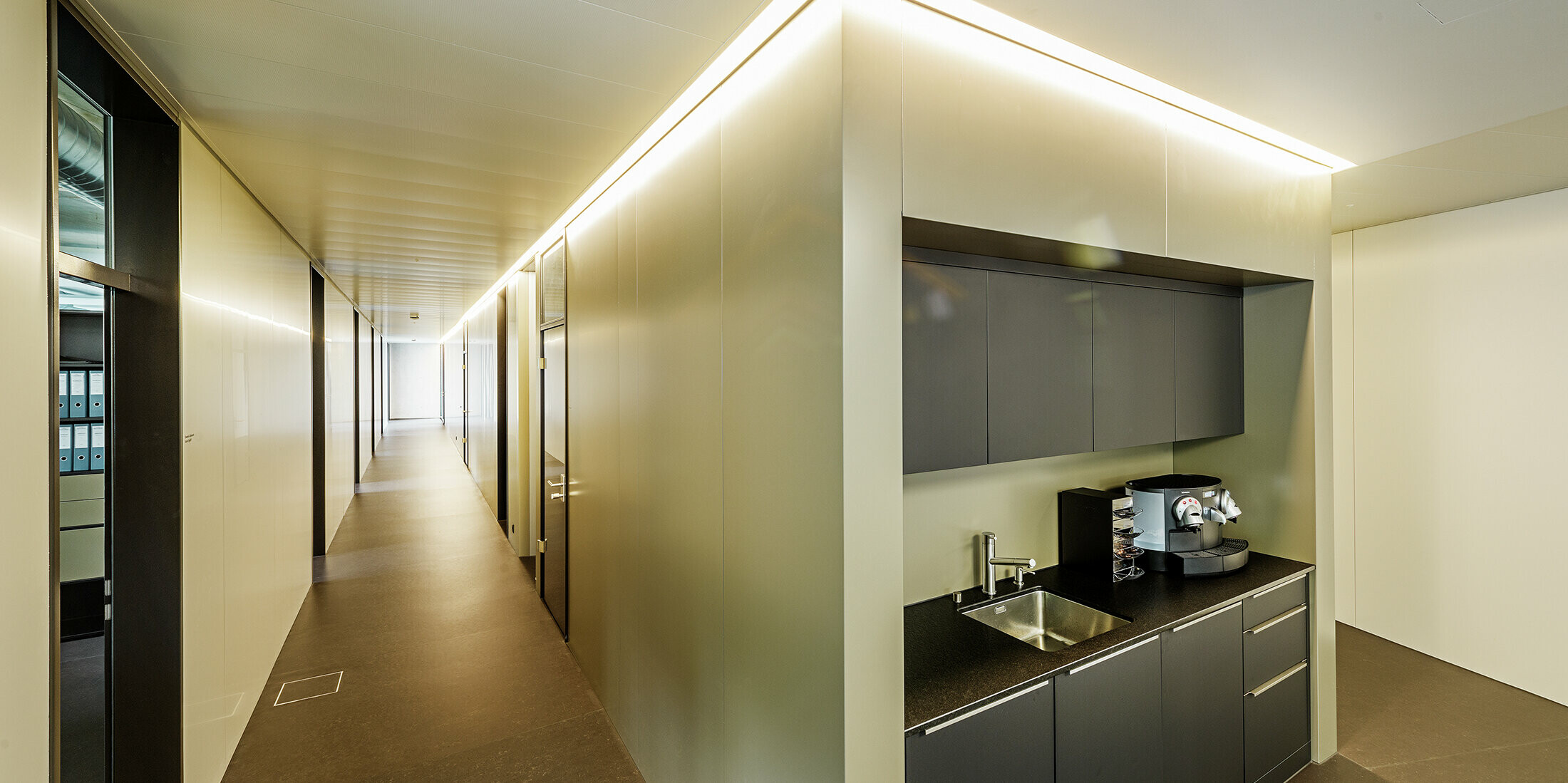Interior design with indirect lighting with aluminium composite panels in bronze