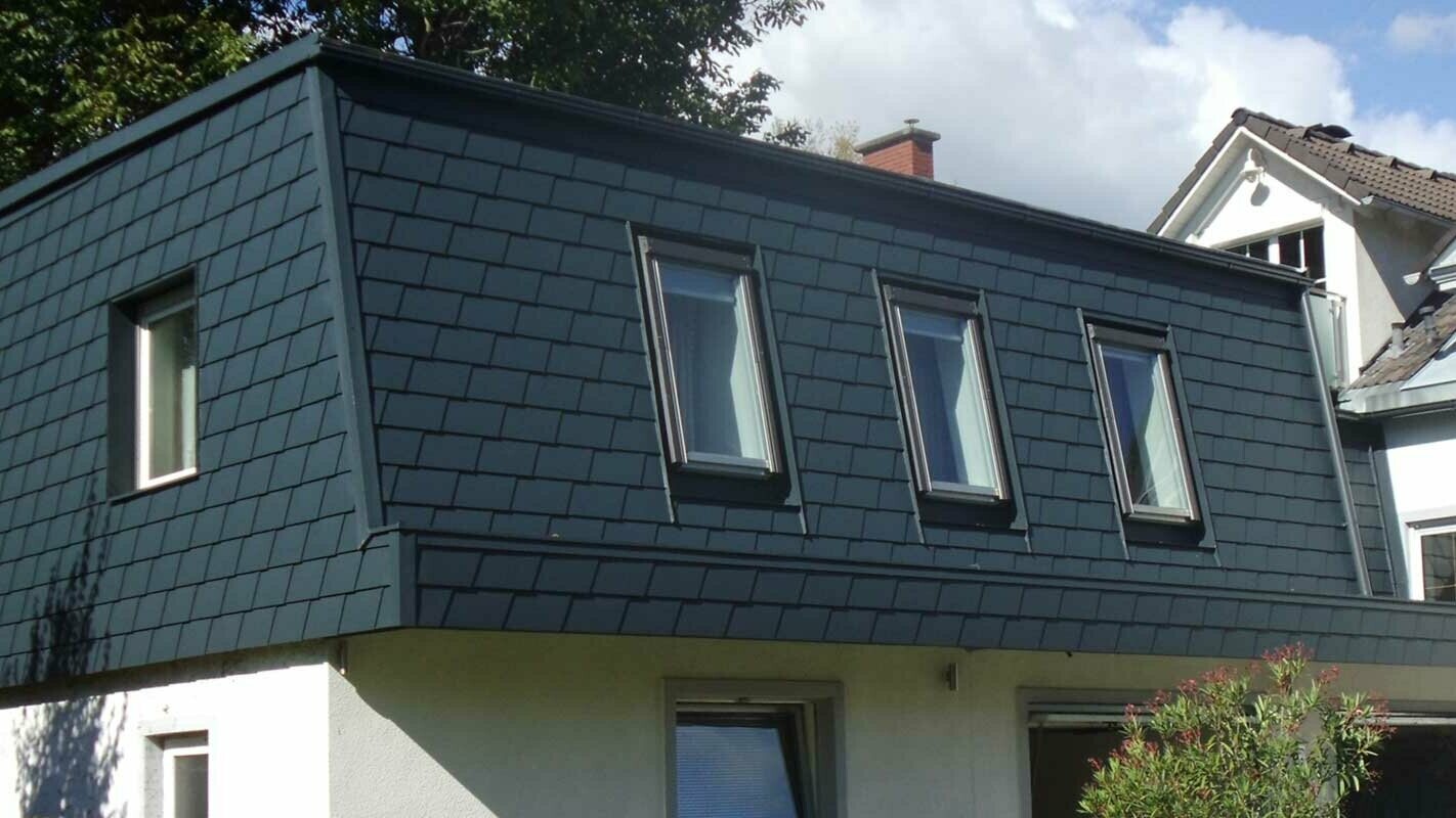 Roof extension with PREFA shingles, modern addition in anthracite with many windows