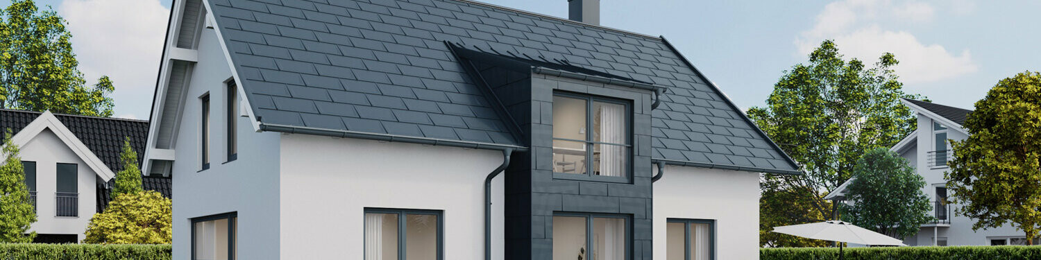 Detached house with gable roof with PREFA R.16 roof panels and FX.12 façade panels in P.10 anthracite 