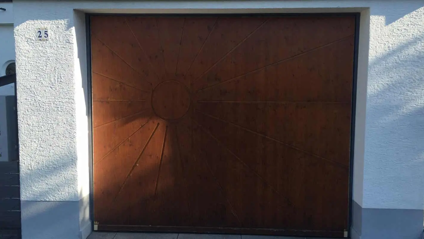 Garage door before renovation with PREFA sidings