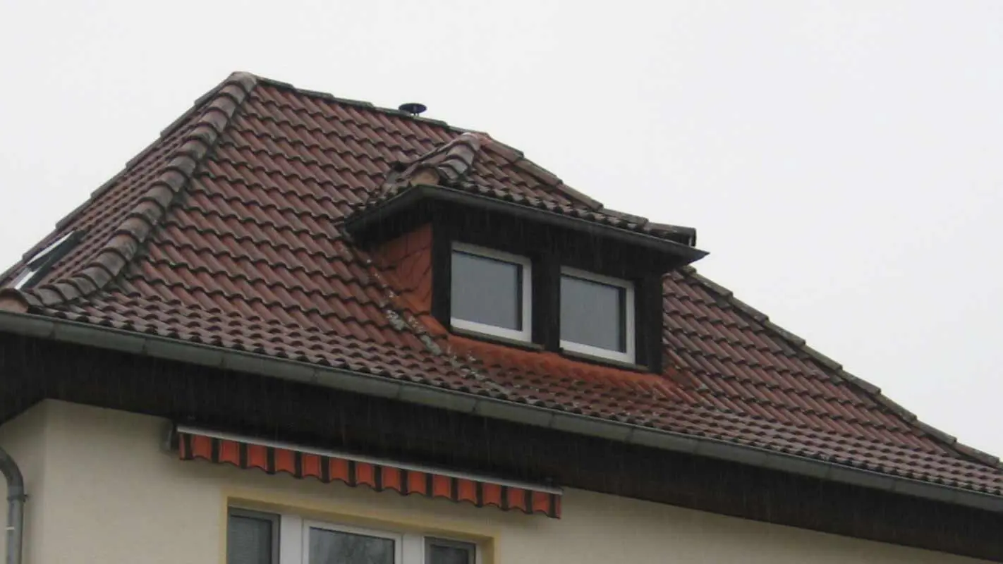 Hip roof with eyebrow dormer before renovation with PREFA shingles