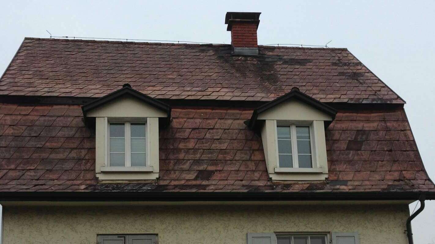 Mansard roof before roof renovation with PREFA roof tiles including dormer cladding