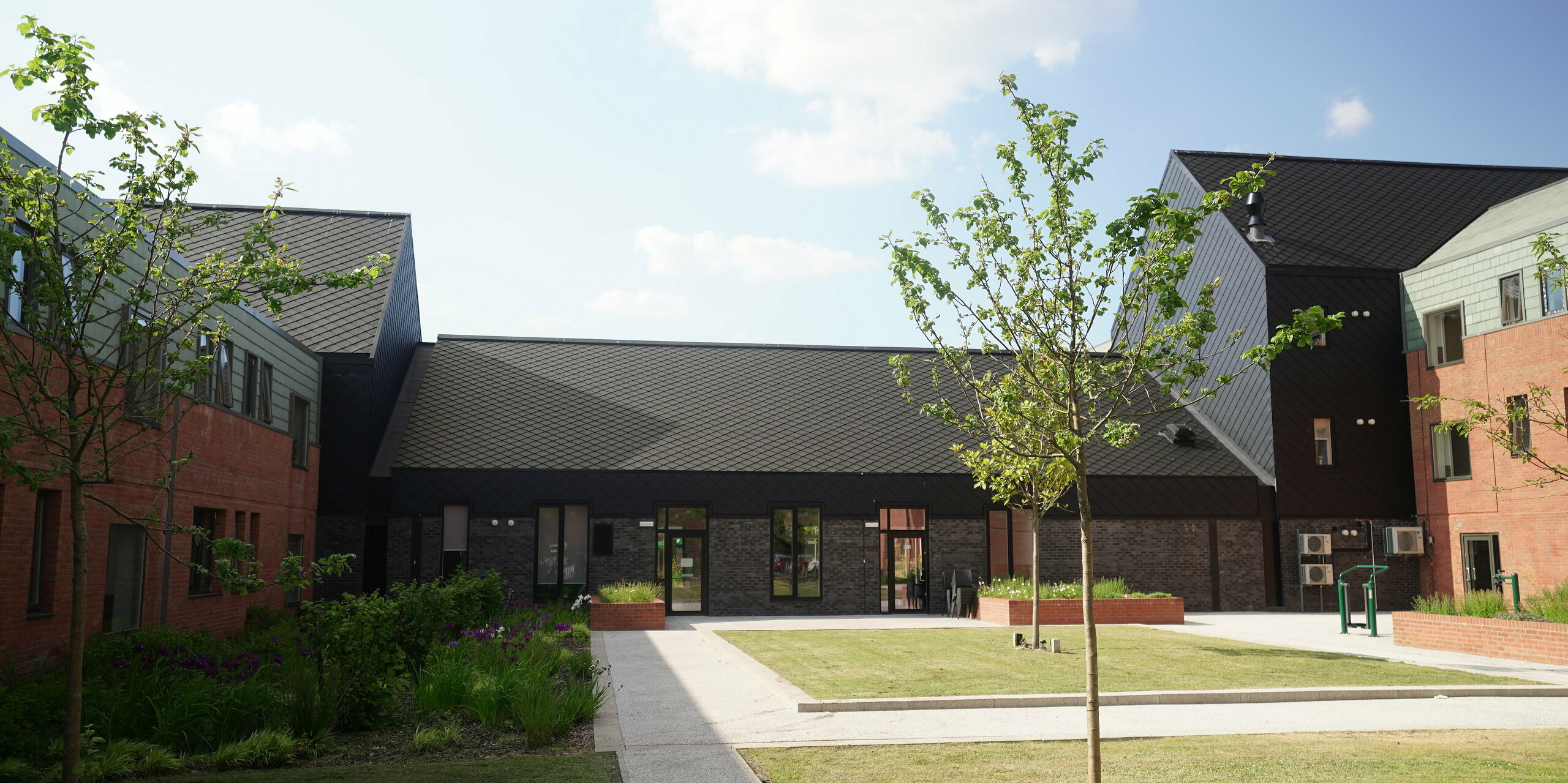 The Courtyards in Preston with a building clad with PREFA rhomboid tile 29 × 29 in P.10 Black