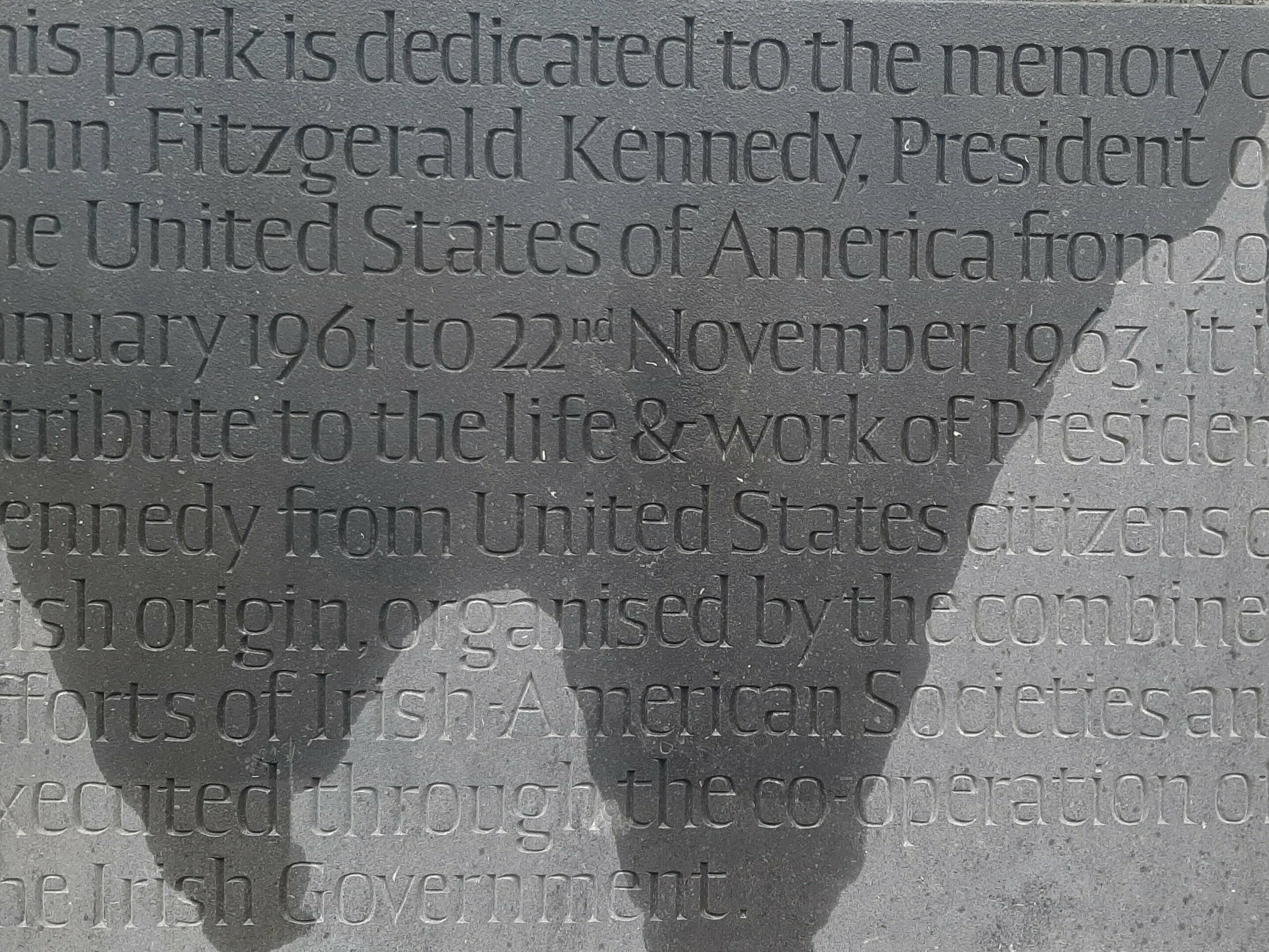 Memorial stone in the John F. Kennedy Aborteum which explains the importance of the park as a memorial.