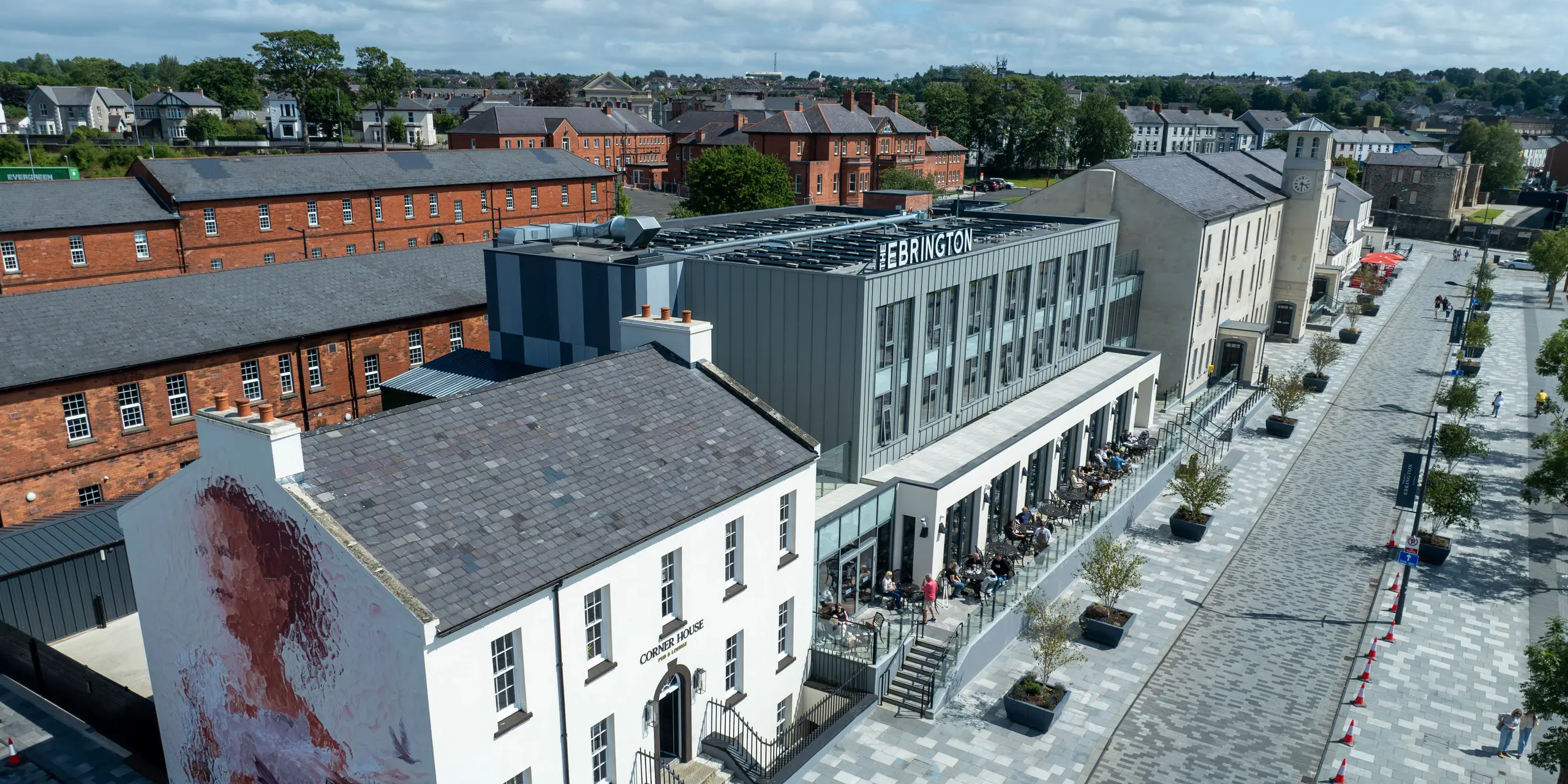 The Ebrington Hotel in the heart of Londonderry, Northern Ireland, is impressive with its modern PREFALZ sheet metal façade in P.10 Light Grey and P.10 Zinc Grey. This stylish and high-quality cladding from PREFA gives the building an elegant appearance and robust protection. The picture also shows the surroundings with historical buildings, which form an interesting contrast to the contemporary architecture of the hotel. The durable aluminium façade ensures a long-lasting aesthetic appearance.