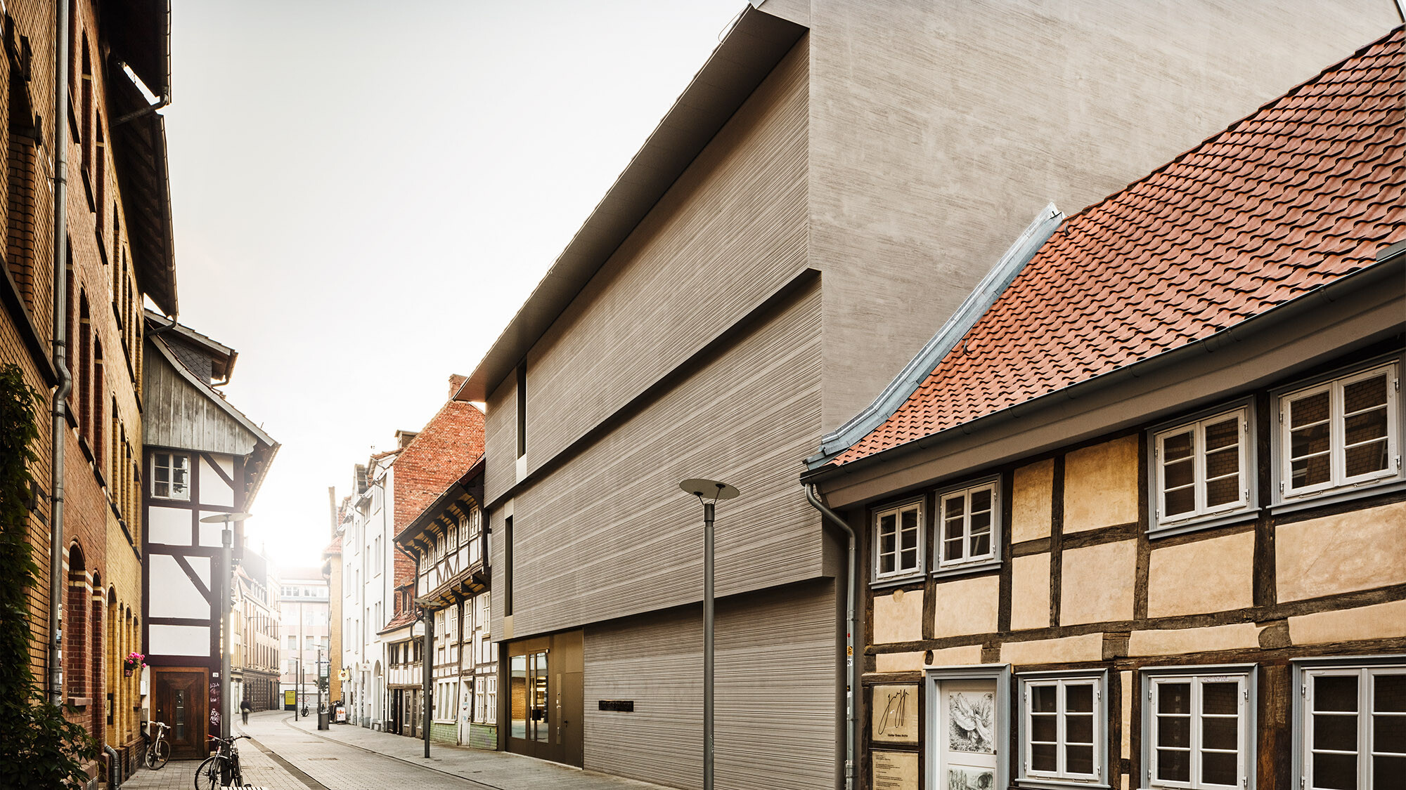 The art museum from a street perspective, surrounded by historic buildings of the old town.