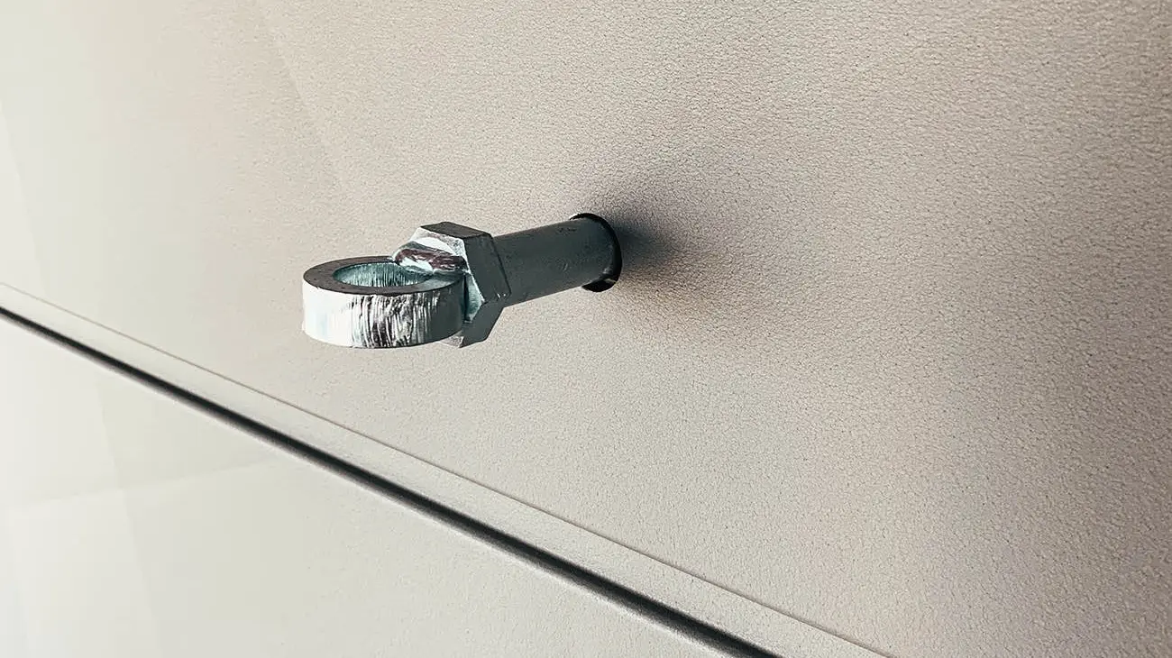 A close-up of the permanent scaffolding anchor on the Prefa aluminium façade Siding.X