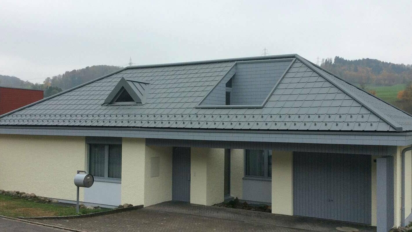 Roof renovation with PREFA roof tiles and a pitched dormer