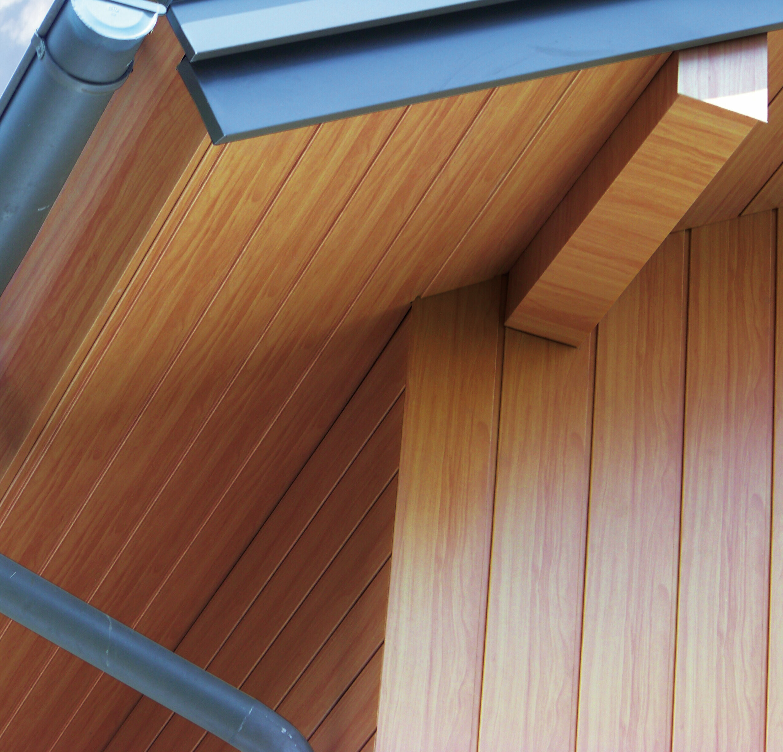 Soffit clad with aluminium PREFA sidings in light wood.