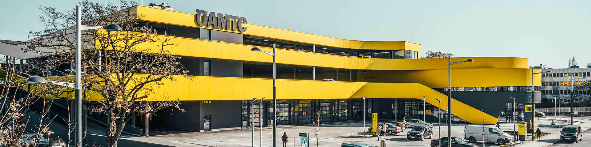 Wide-angle view of the new ÖAMTC building in Vienna. the yellow façade immediately stands out and becomes an eye-catcher.