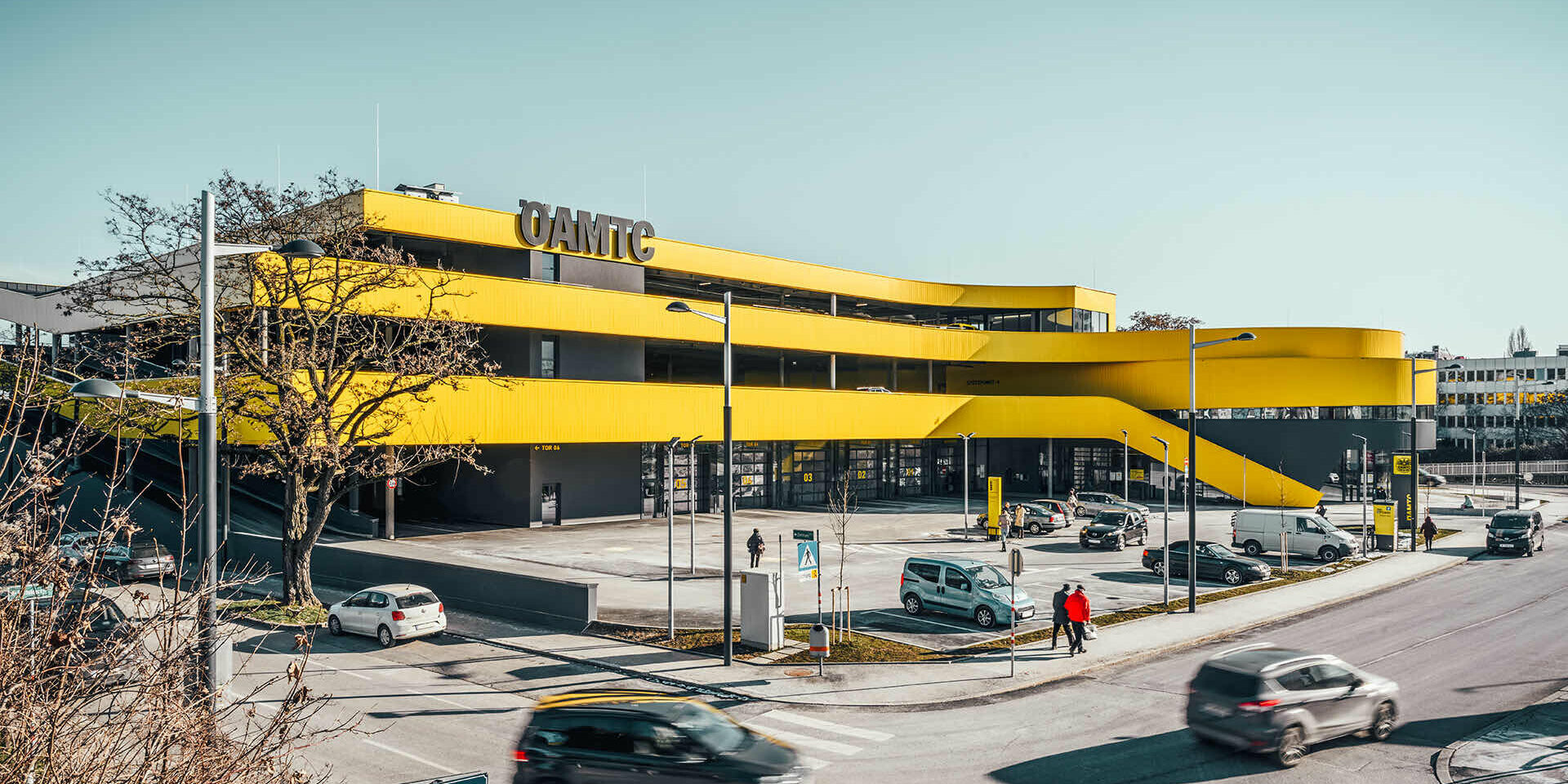 Wide-angle view of the new ÖAMTC building in Vienna. the yellow façade immediately stands out and becomes an eye-catcher.