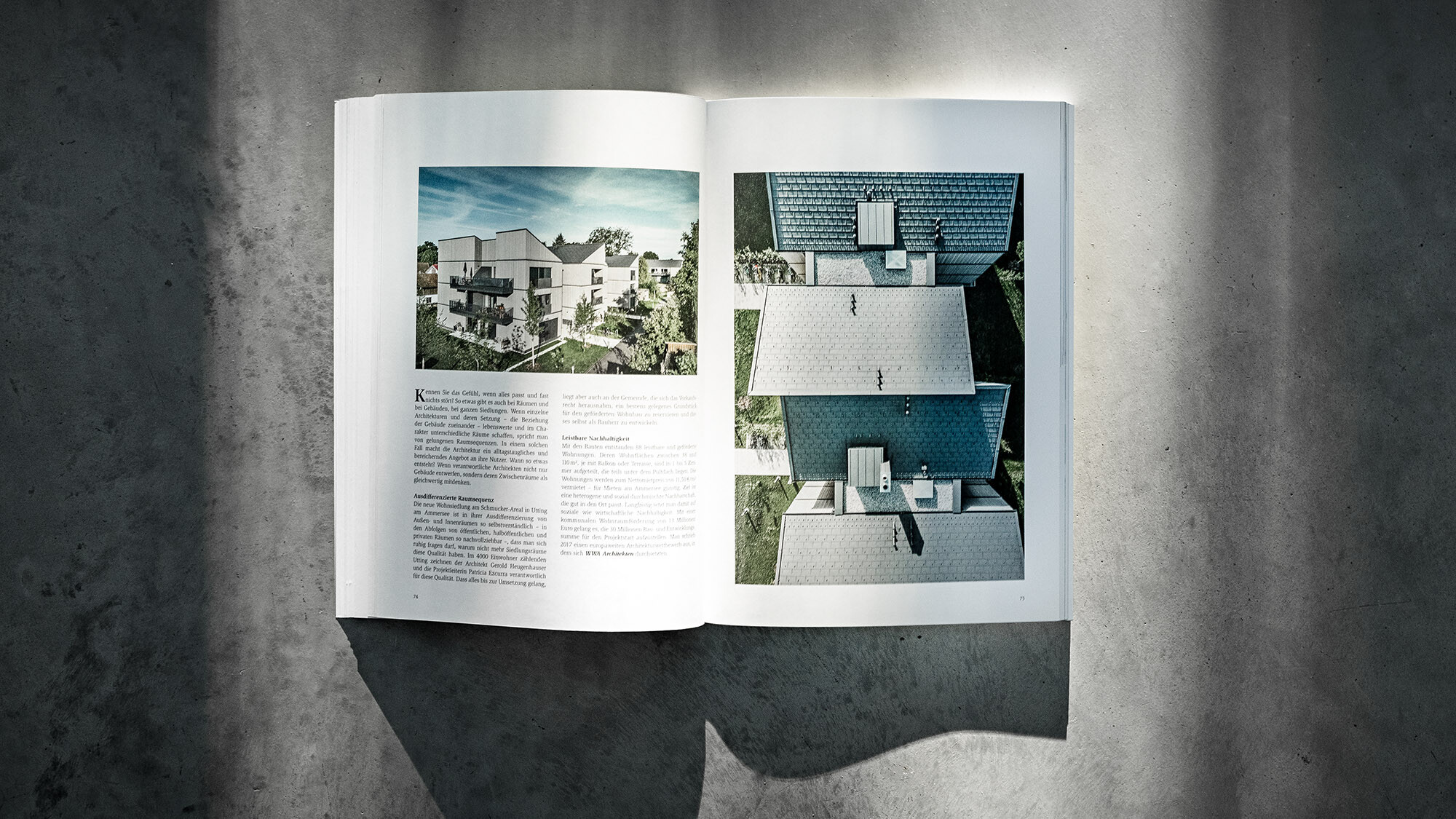 The open PREFARENZEN book 2024 with an article on the Schmucker complex by WWA Architekten before a grey background.