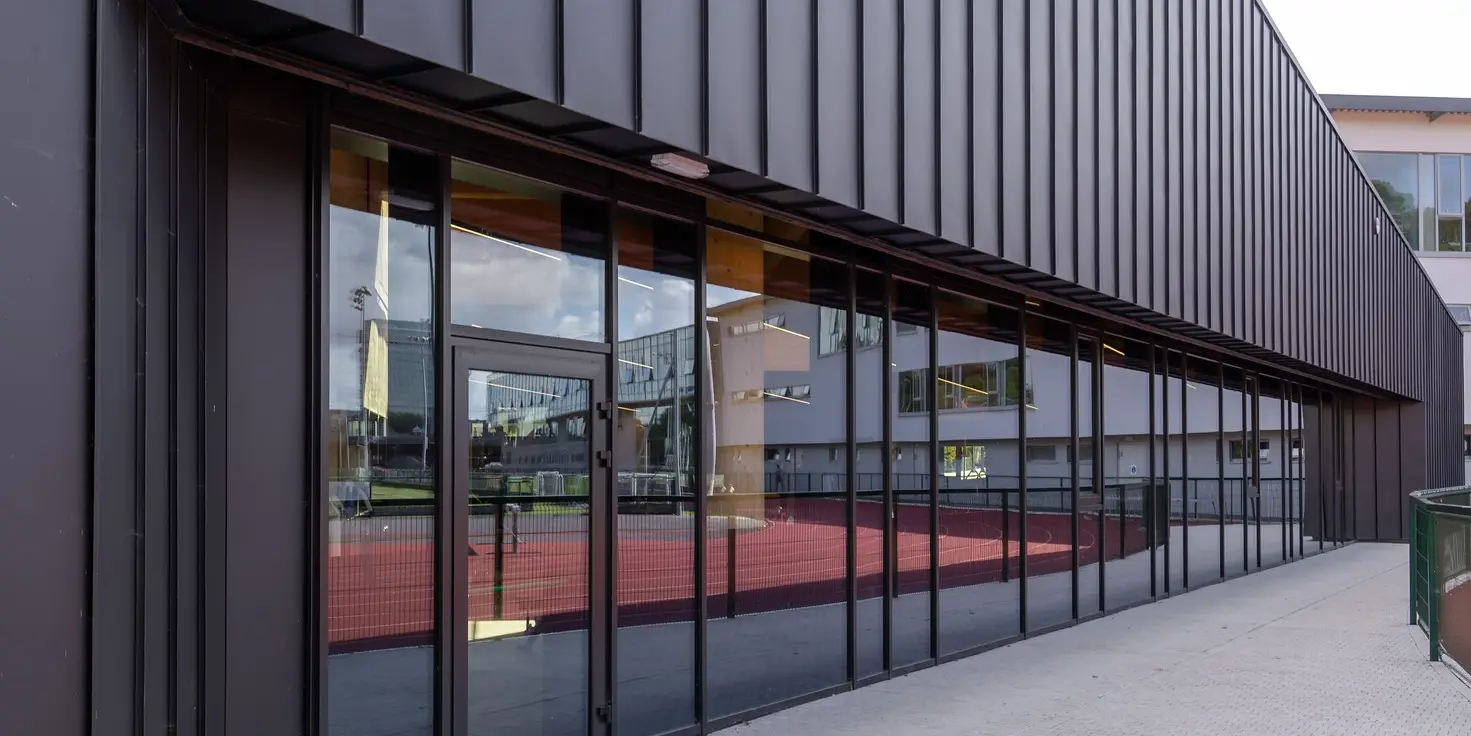 New construction of the Mardyke Arena at University College Cork in Ireland wrapped with PREFALZ in P.10 Black