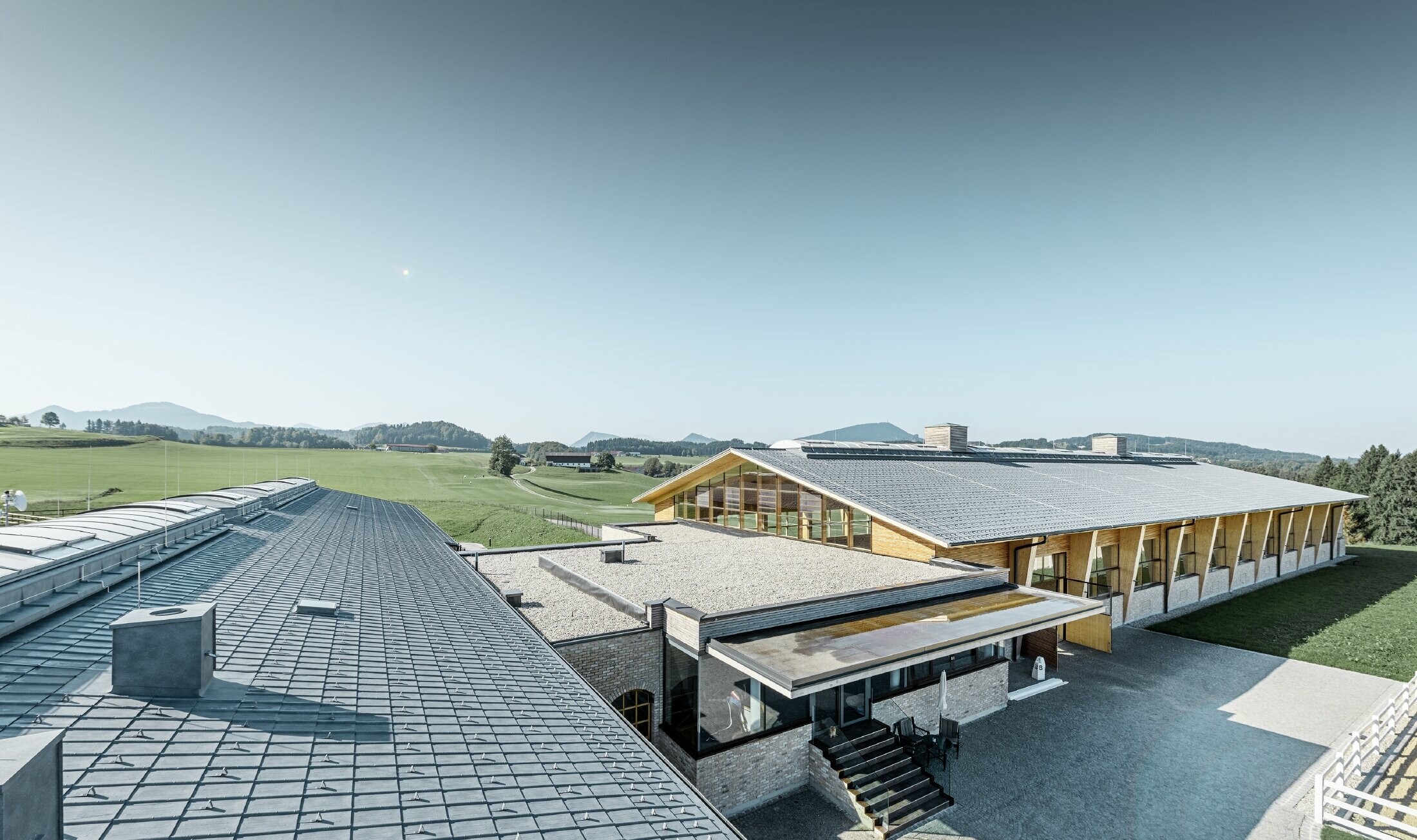 Stud farm in Thalgau with classic gabled roof covered with the PREFA roof tile in stone grey