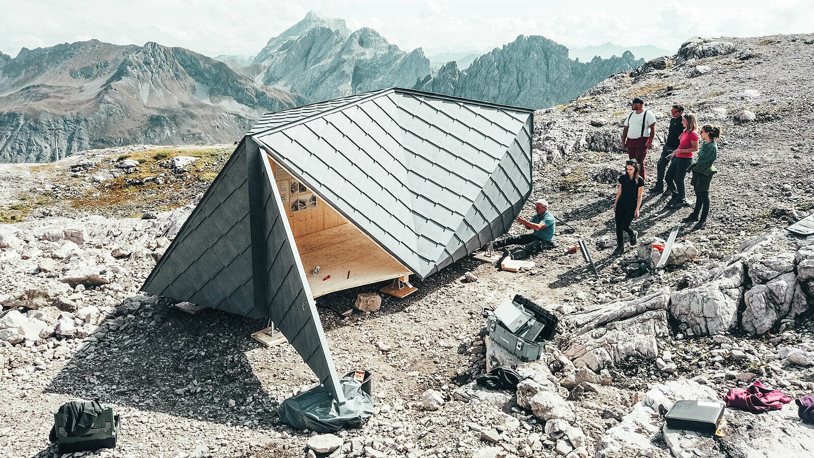 Alongside the four students responsible for the project, the fabricators anchor the object to the stony terrain.