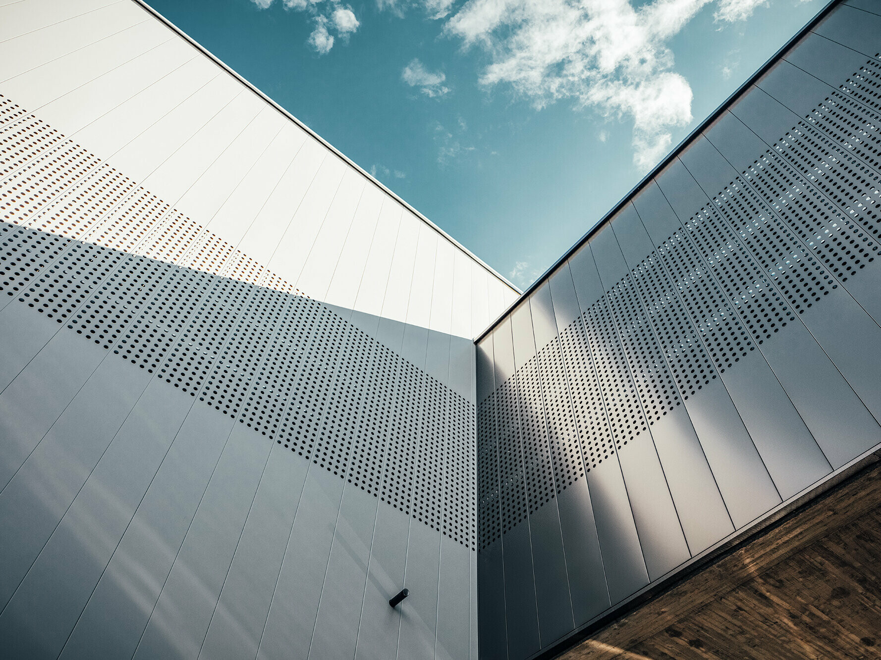 Close-up of the long siding panels on the ice rink.