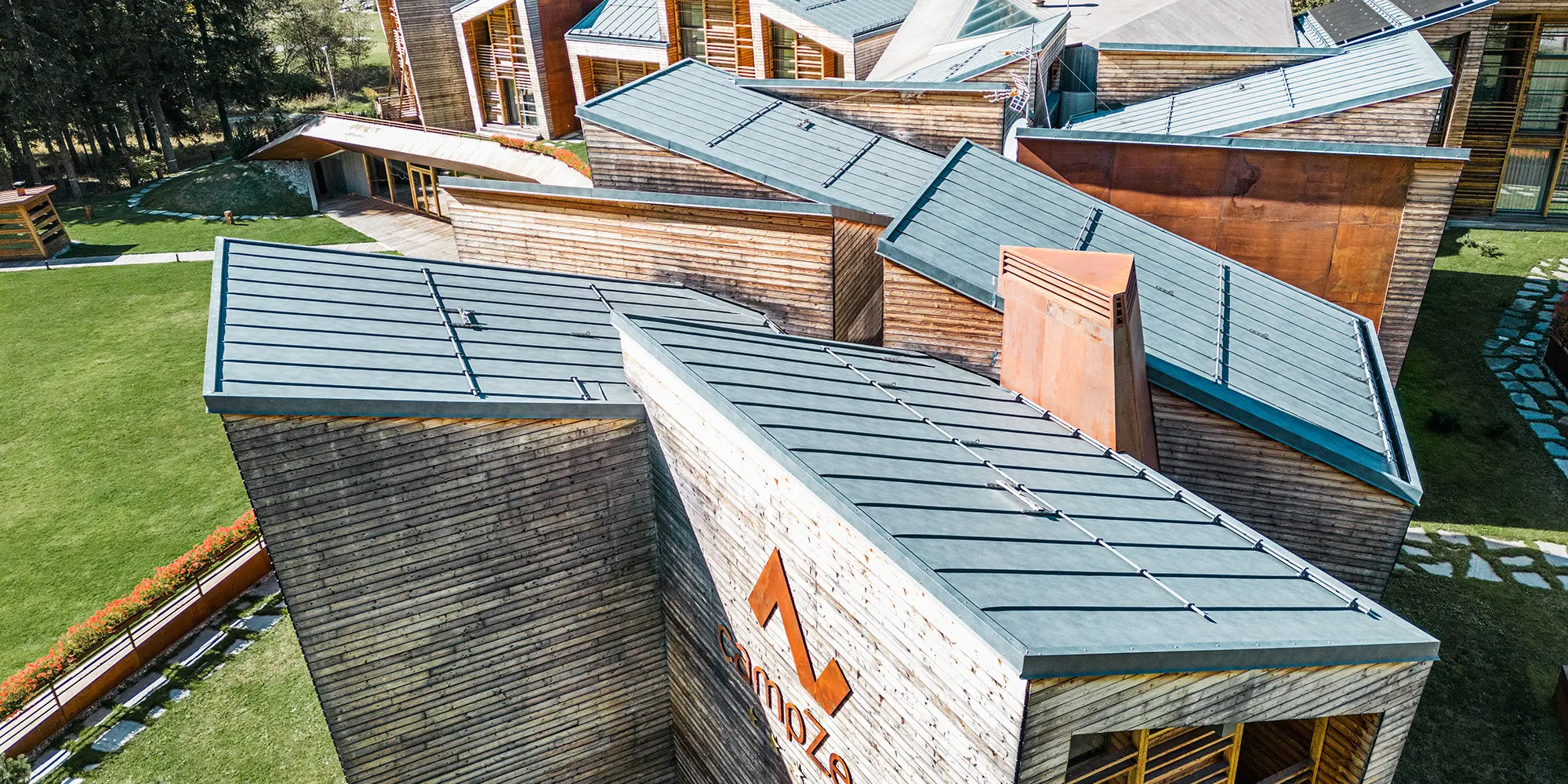 Detail view of one of the sides of the resort, the stone-grey roofscape is in view. 